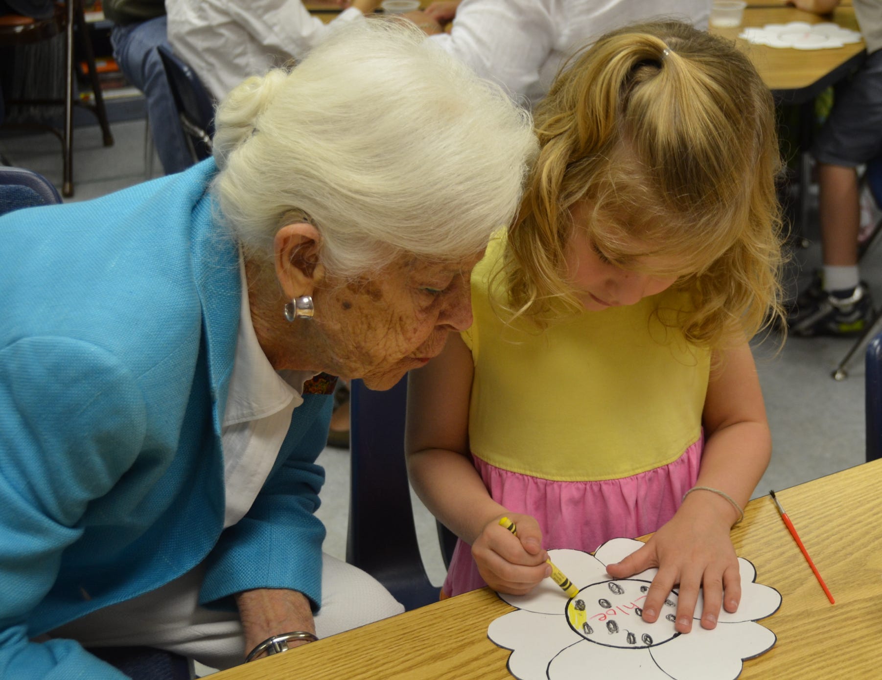 A grandmother visits her grandaughter on Special People's Day at The Awty International School, Houston.