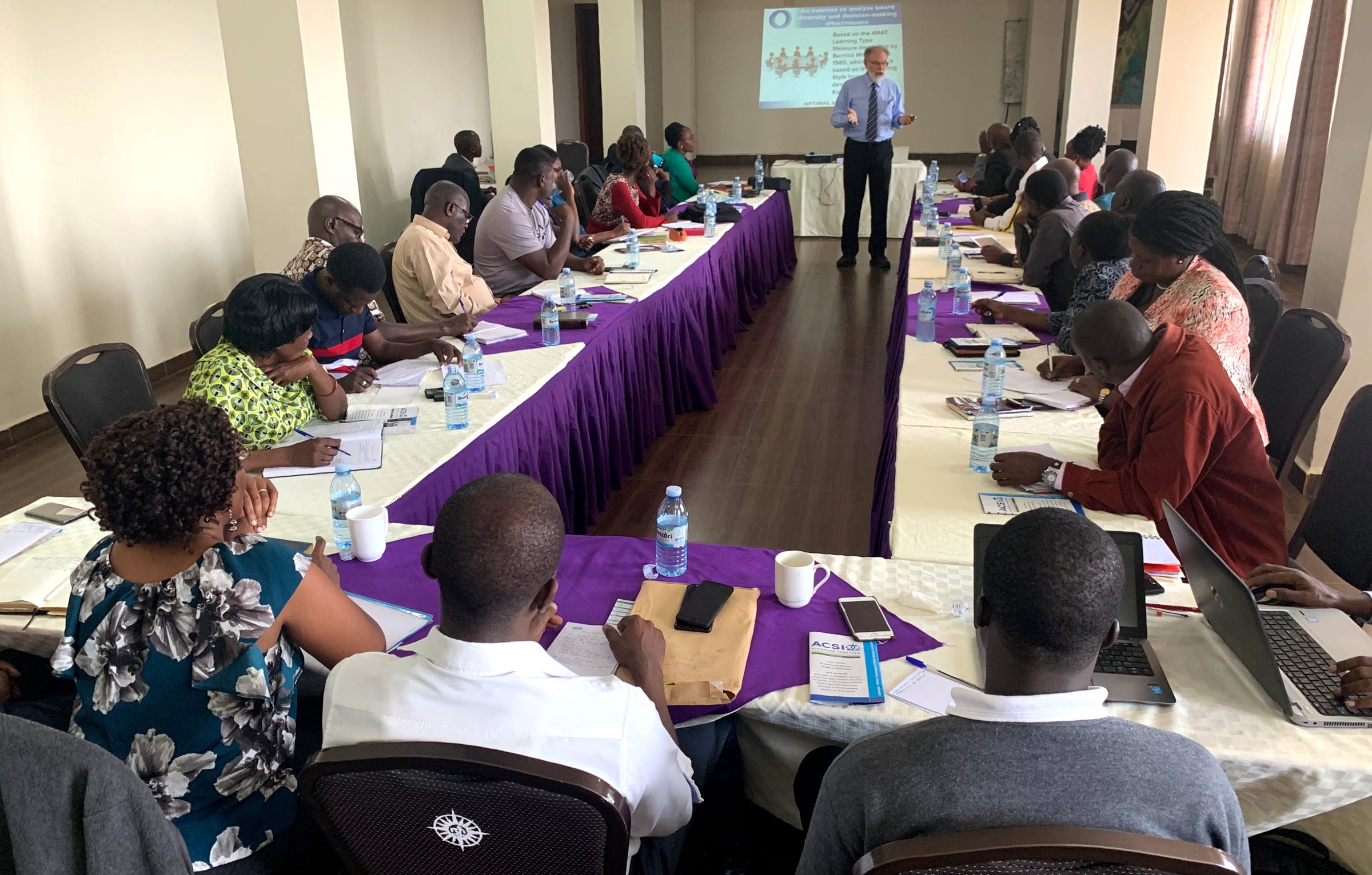 Stephen Codrington presenting a workshop on school board governance to East African Principals and board members at Namirembe Guest House, Kampala, Uganda