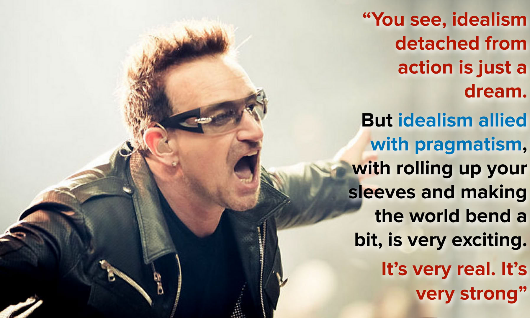Bono at a concert with his quote about idealis.  Based on Peter Neill, CC BY 2.0 <https://creativecommons.org/licenses/by/2.0>, via Wikimedia Commons