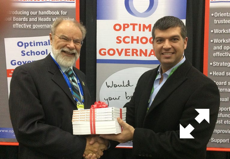 Stephen Codrington presents ten copies of the book Optimal School Governance at the NAIS conference